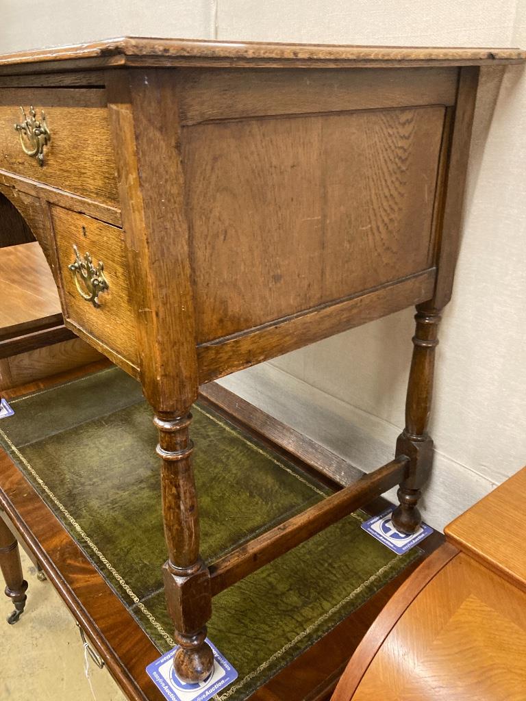 An early 20th century oak kneehole writing table, width 106cm, depth 55cm, height 77cm